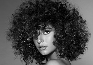 A woman with short curly hair